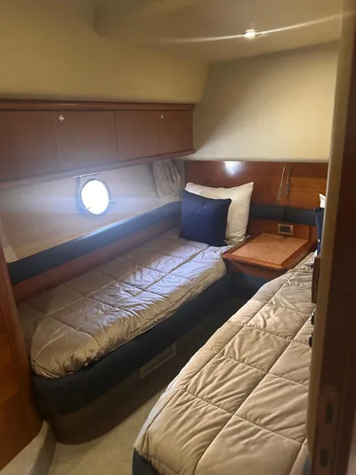  Yacht Photos Pics 2007 Azimut 55E yacht cabin with twin beds and wooden accents.