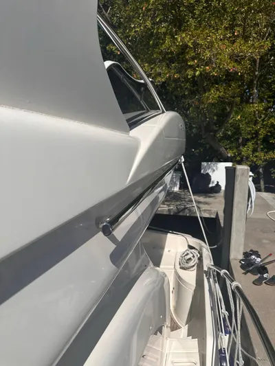  Yacht Photos Pics 2007 Azimut 55E yacht docked, side view with sleek design and outdoor setting.