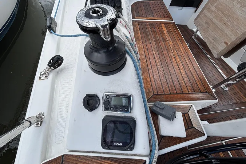 Respite Yacht Photos Pics Deck of 2014 Hanse 345 sailboat with winch, ropes, and navigation equipment.