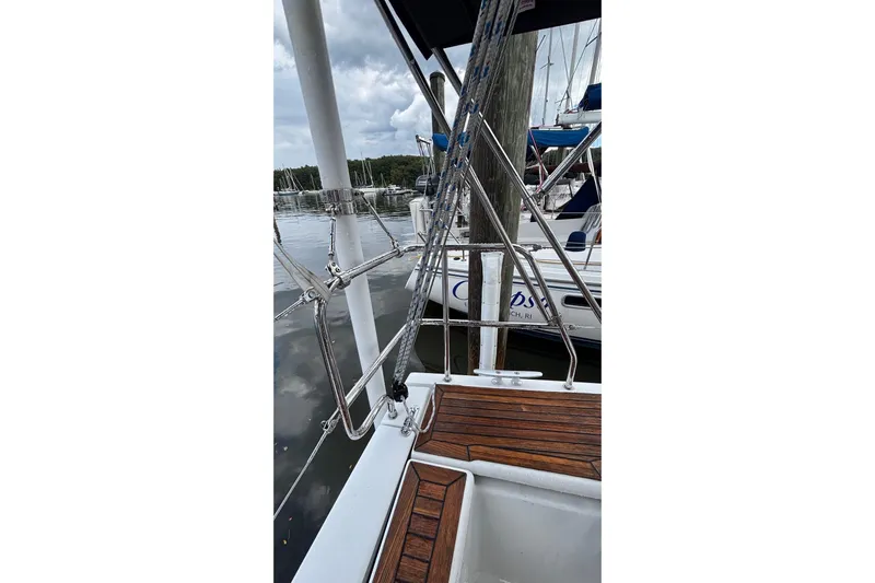 Respite Yacht Photos Pics 2014 Hanse 345 sailboat docked, featuring wooden deck and rigging details.