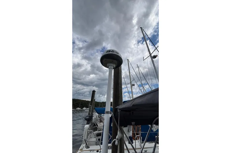 Respite Yacht Photos Pics Sailboat Hanse 345 (2014) docked under cloudy skies, featuring B&G equipment.