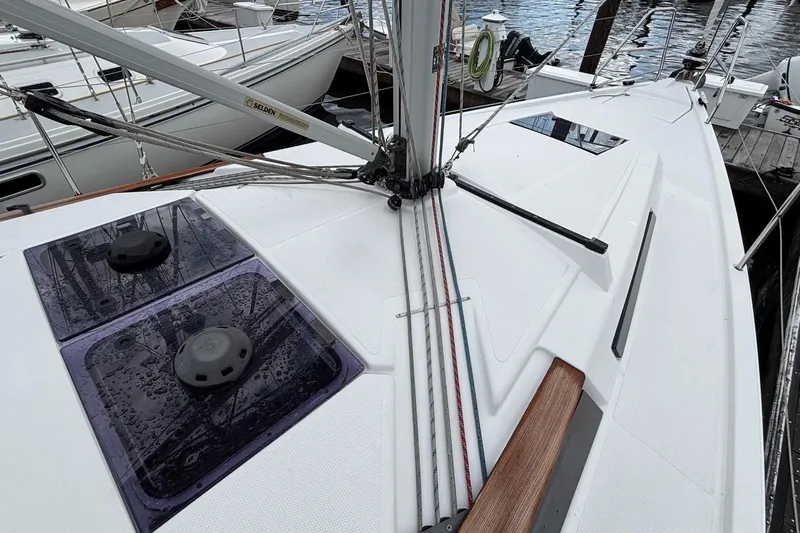 Respite Yacht Photos Pics 2014 Hanse 345 sailboat deck with rigging and hatches, docked at marina.