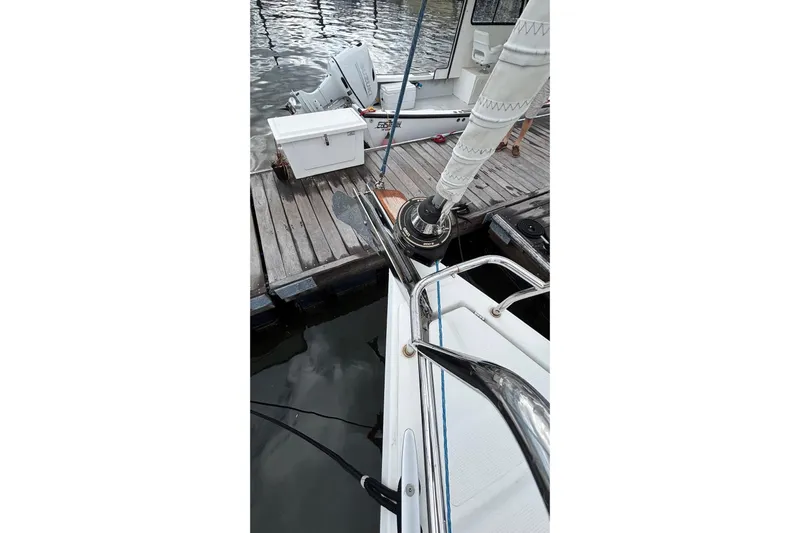 Respite Yacht Photos Pics 2014 Hanse 345 yacht docked at marina with visible sail and deck.