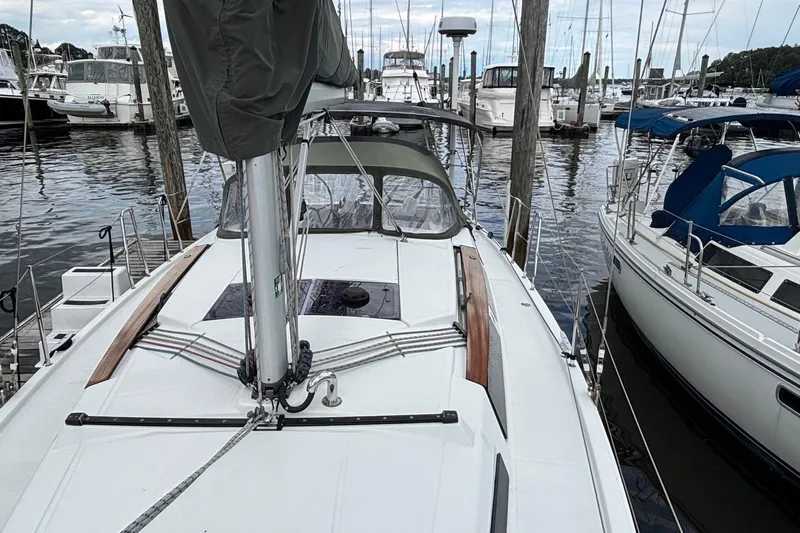 Respite Yacht Photos Pics 2014 Hanse 345 sailboat docked at marina, surrounded by other boats.