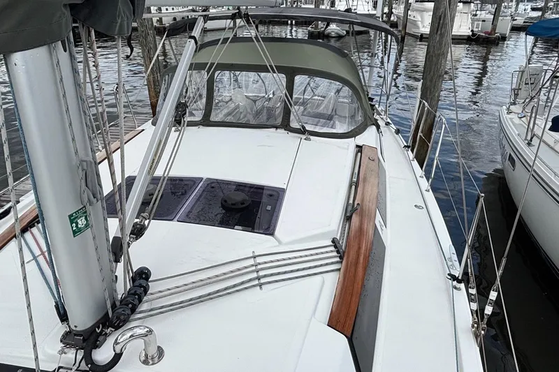 Respite Yacht Photos Pics 2014 Hanse 345 sailboat docked at marina, featuring sleek deck design and modern rigging.