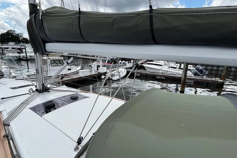 Respite Yacht Photos Pics 2014 Hanse 345 sailboat docked at marina, featuring covered boom and rigging.