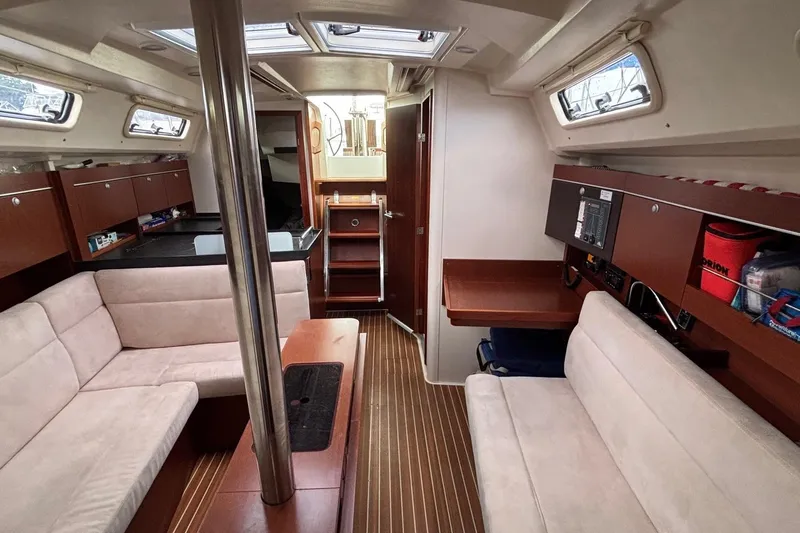Respite Yacht Photos Pics Interior of 2014 Hanse 345 sailboat with cozy seating and wooden finishes.