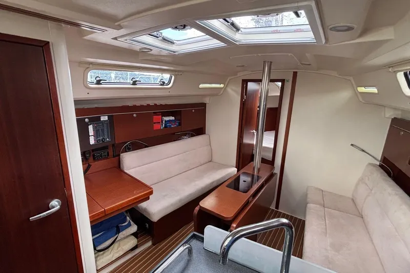 Respite Yacht Photos Pics Interior of 2014 Hanse 345 sailboat with cozy seating and wooden finishes.