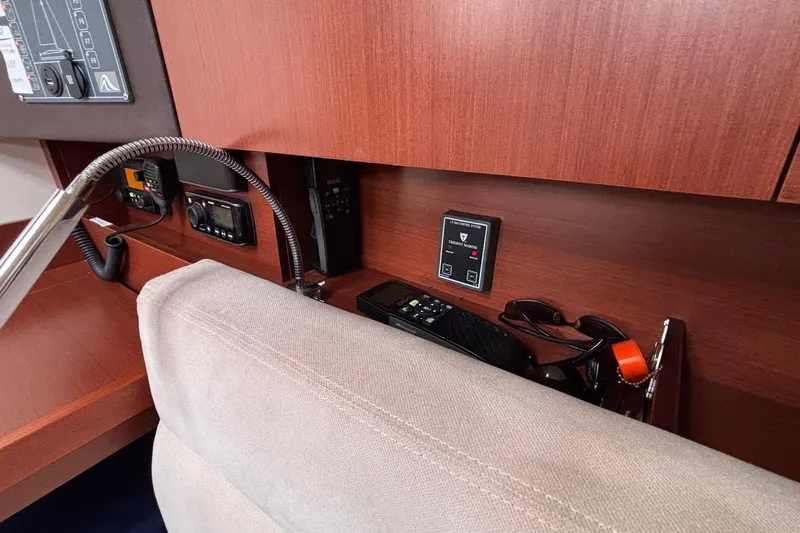 Respite Yacht Photos Pics Interior of 2014 Hanse 345 yacht with control panel and storage area.
