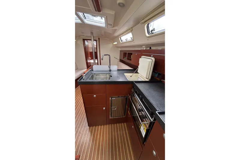 Respite Yacht Photos Pics 2014 Hanse 345 yacht interior kitchen with modern appliances and wood finish.
