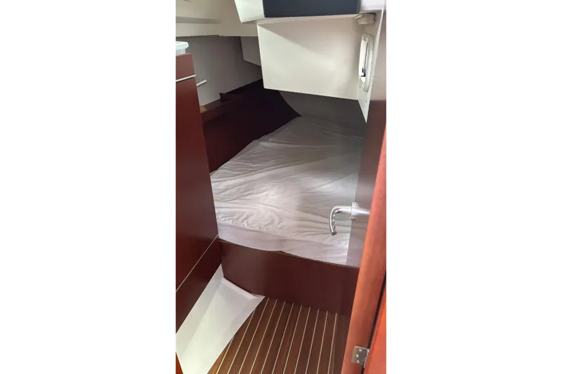 Respite Yacht Photos Pics 2014 Hanse 345 yacht cabin interior with wooden finish and cozy bed.