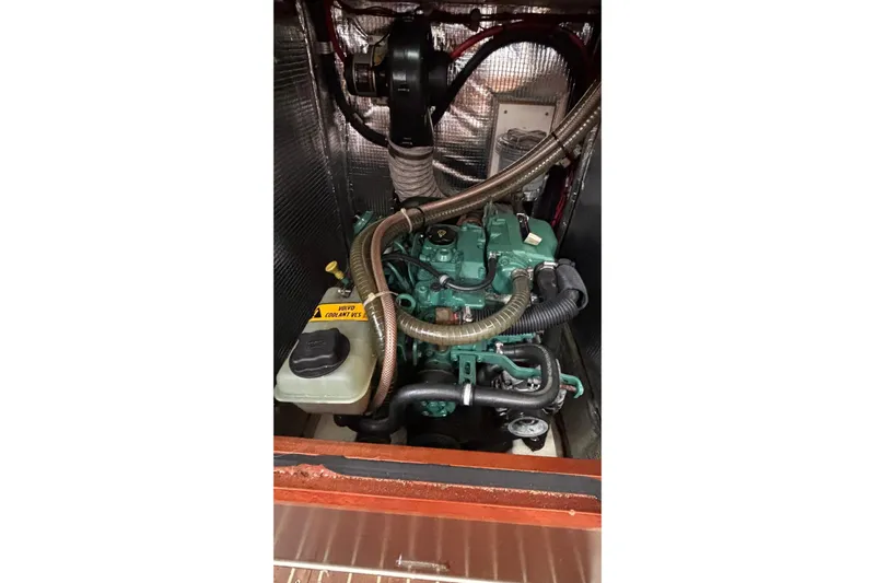 Respite Yacht Photos Pics Engine compartment of a 2014 Hanse 345 sailboat, featuring a Volvo Penta engine.