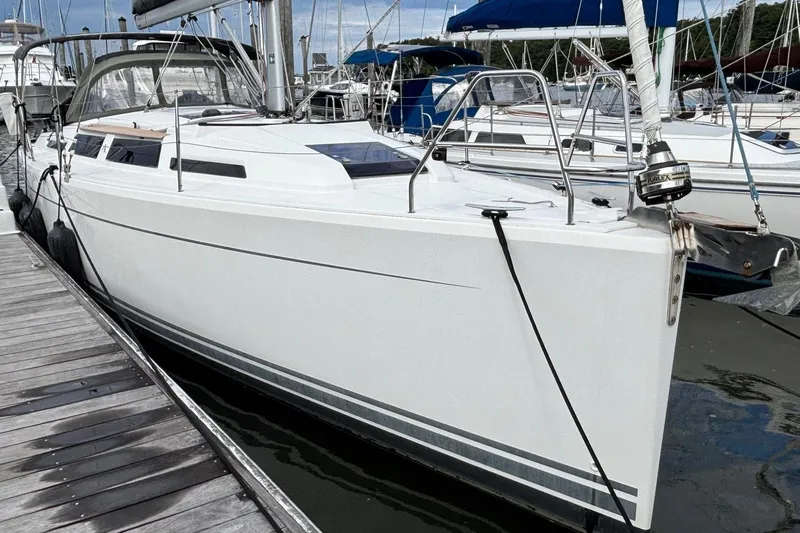 Respite Yacht Photos Pics 2014 Hanse 345 sailboat docked at marina, sleek white design, ready for sailing adventure.