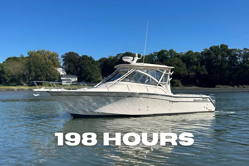  Yacht Photos Pics 2016 Grady-White Express 330 boat on water, 198 hours usage, clear sky background.
