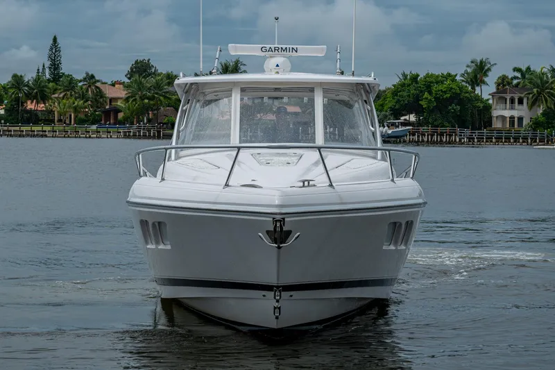  Yacht Photos Pics 2019 Intrepid 407 Cuddy boat on water, front view with Garmin equipment.