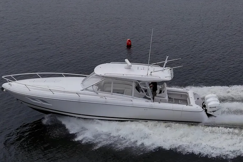  Yacht Photos Pics 2019 Intrepid 407 Cuddy cruising on water, showcasing sleek design and powerful engines.