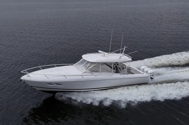  Yacht Photos Pics 2019 Intrepid 407 Cuddy cruising on open water, showcasing sleek design and powerful performance.