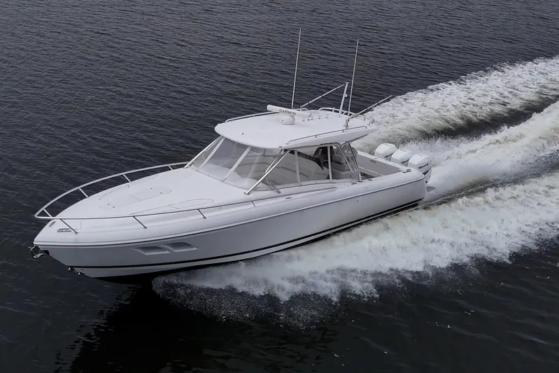  Yacht Photos Pics 2019 Intrepid 407 Cuddy cruising on open water, showcasing sleek design and powerful performance.