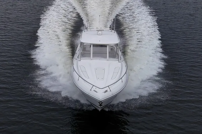  Yacht Photos Pics 2019 Intrepid 407 Cuddy cruising on water, creating a dynamic wake pattern.