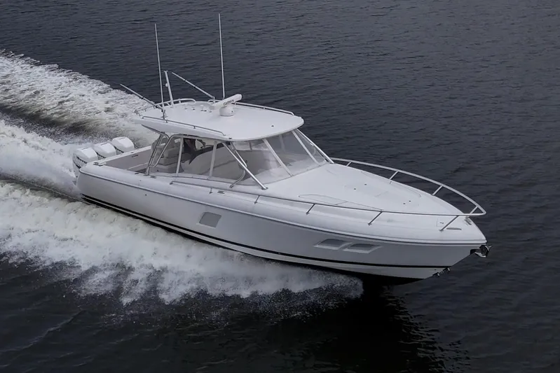  Yacht Photos Pics 2019 Intrepid 407 Cuddy cruising on open water, showcasing sleek design and powerful performance.