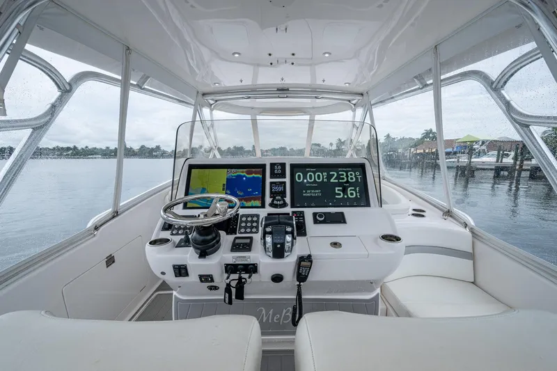  Yacht Photos Pics 2019 Intrepid 407 Cuddy helm with advanced navigation displays and steering wheel.