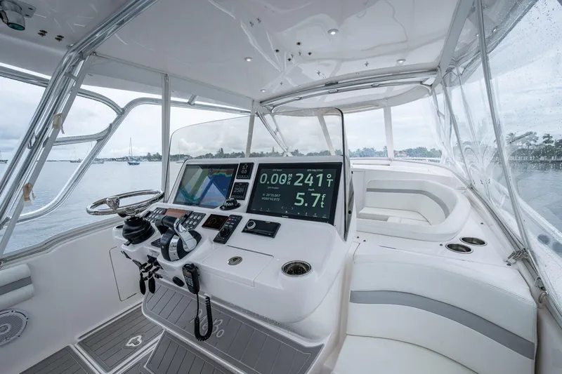  Yacht Photos Pics 2019 Intrepid 407 Cuddy boat interior with advanced navigation system and luxurious seating.