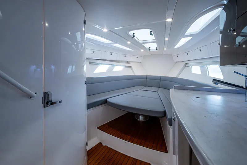  Yacht Photos Pics Interior of 2019 Intrepid 407 Cuddy boat with modern seating and skylights.