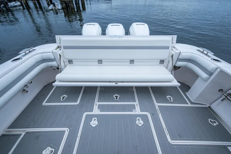  Yacht Photos Pics 2019 Intrepid 407 Cuddy boat with spacious seating and sleek deck design.