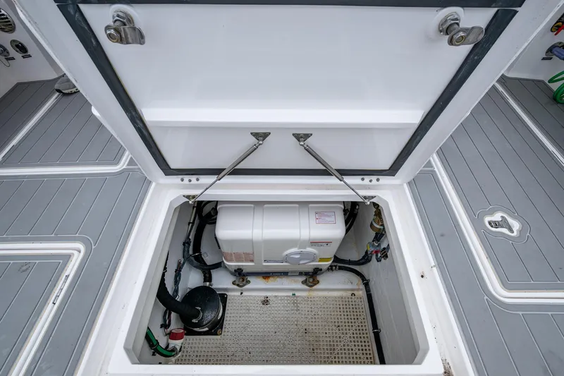  Yacht Photos Pics Open hatch of 2019 Intrepid 407 Cuddy boat showing internal equipment.