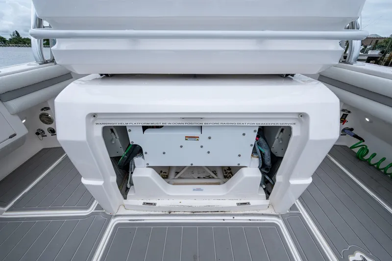  Yacht Photos Pics 2019 Intrepid 407 Cuddy boat interior with helm platform and storage compartment.