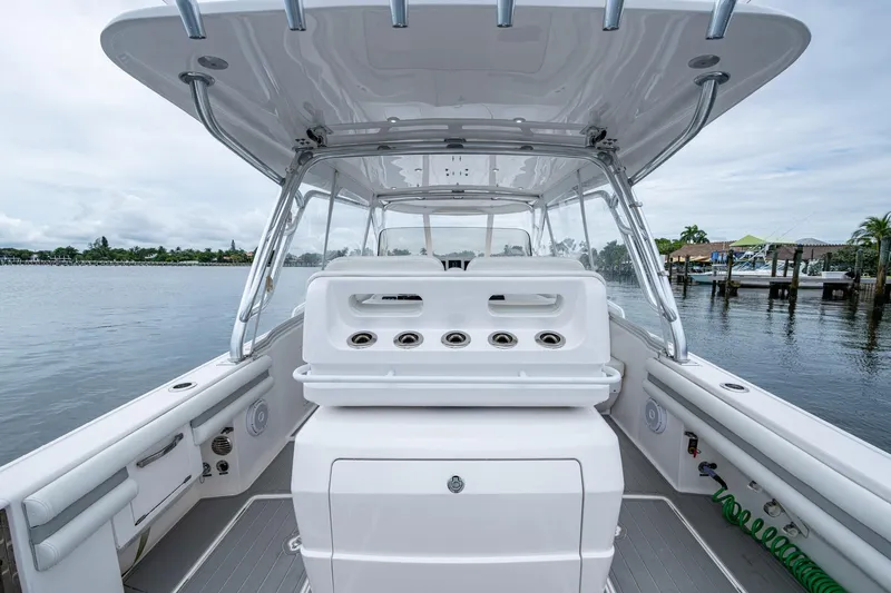  Yacht Photos Pics 2019 Intrepid 407 Cuddy boat interior with helm station, dockside view.