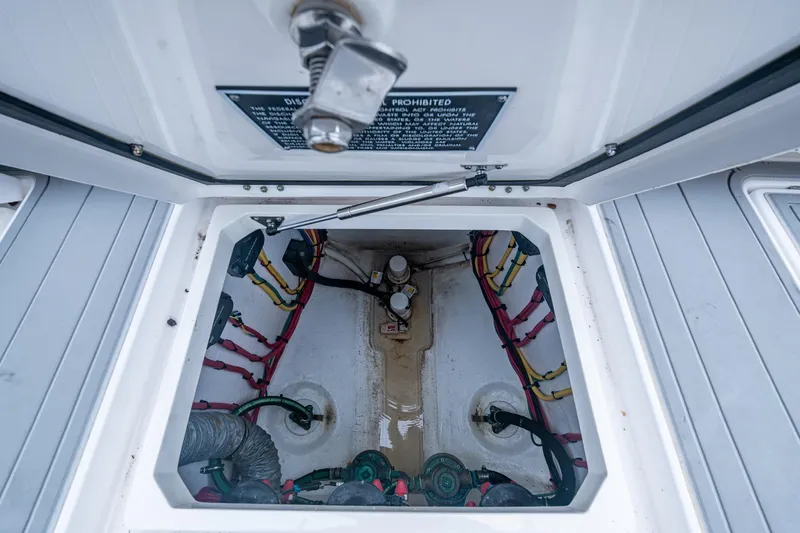  Yacht Photos Pics 2019 Intrepid 407 Cuddy engine compartment with wiring and mechanical components visible.