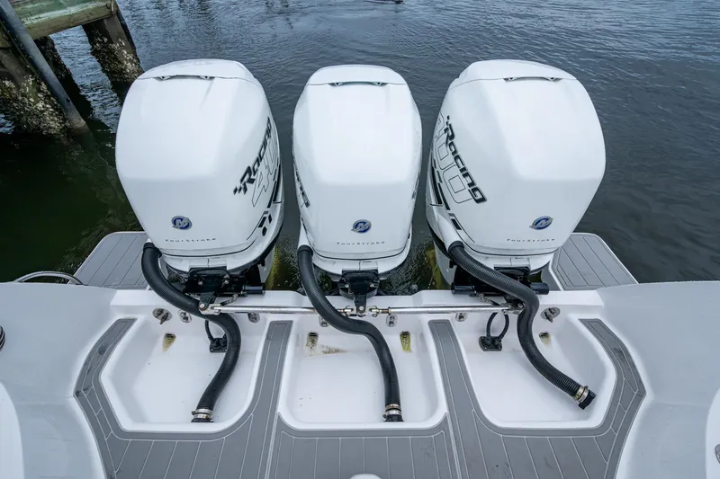  Yacht Photos Pics 2019 Intrepid 407 Cuddy with triple outboard engines on water.