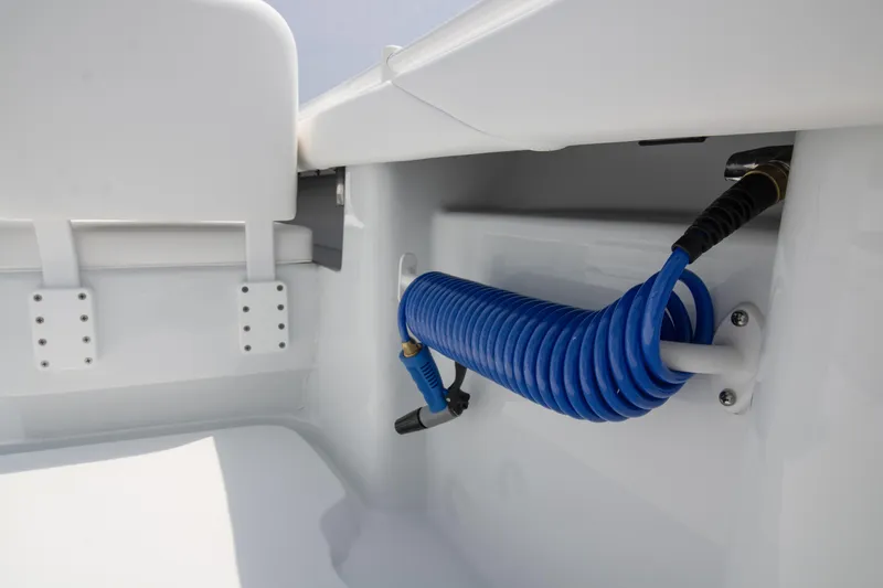  Yacht Photos Pics 2025 Yellowfin 26 Hybrid boat interior with coiled blue hose.