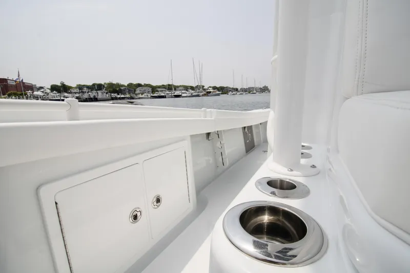  Yacht Photos Pics 2025 Yellowfin 26 Hybrid boat interior with cup holders, docked at marina.