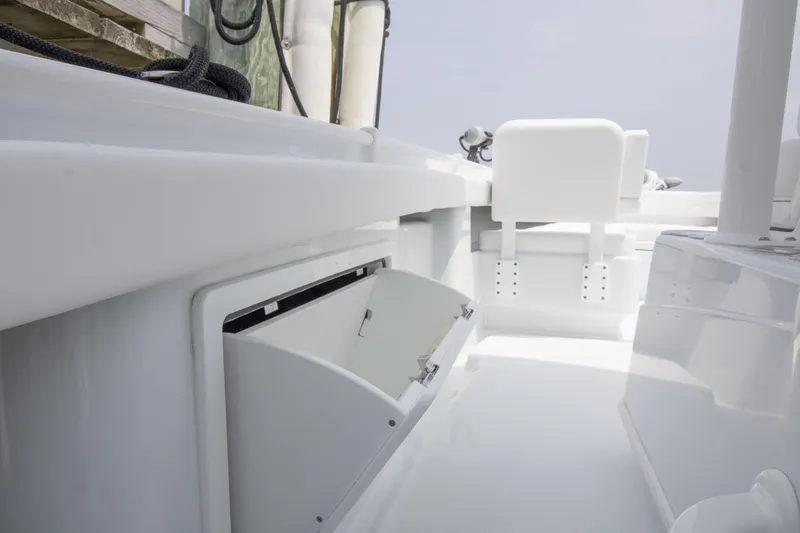  Yacht Photos Pics 2025 Yellowfin 26 Hybrid boat interior with open storage compartment.