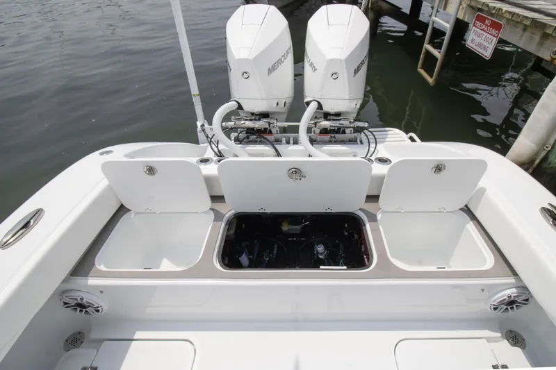  Yacht Photos Pics 2025 Yellowfin 26 Hybrid boat with dual Mercury engines and open storage compartments.