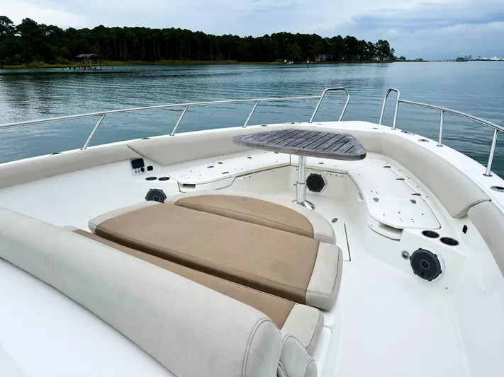 Seas The Day Yacht Photos Pics 2017 Boston Whaler 420 Outrage boat with spacious seating and scenic water view.