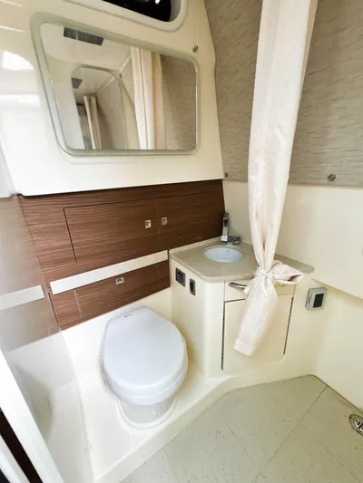 Seas The Day Yacht Photos Pics 2017 Boston Whaler 420 Outrage bathroom with modern fixtures and elegant design.