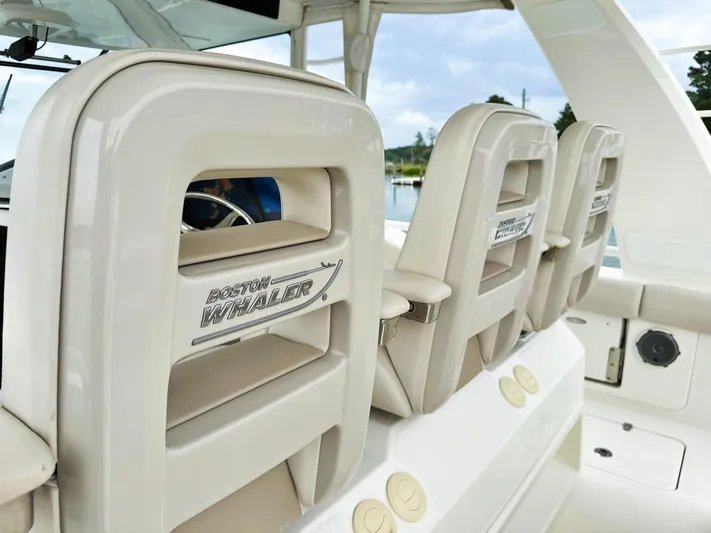 Seas The Day Yacht Photos Pics 2017 Boston Whaler 420 Outrage boat seats with logo, showcasing luxury marine design.