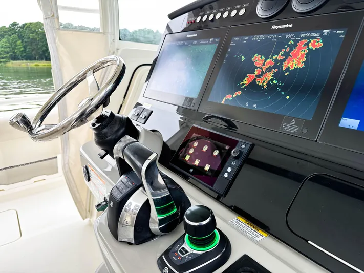 Seas The Day Yacht Photos Pics Helm of 2017 Boston Whaler 420 Outrage with advanced navigation displays and controls.