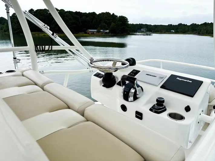 Seas The Day Yacht Photos Pics 2017 Boston Whaler 420 Outrage helm with scenic water view.