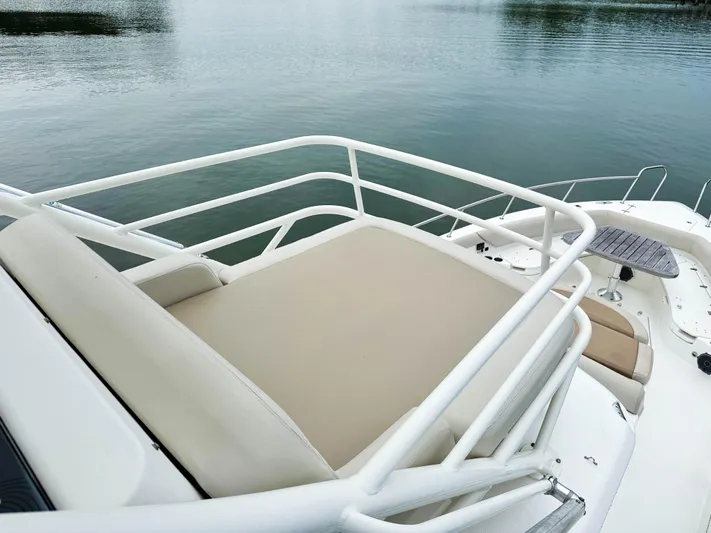 Seas The Day Yacht Photos Pics Boston Whaler 420 Outrage 2017 boat with spacious deck seating and railing.