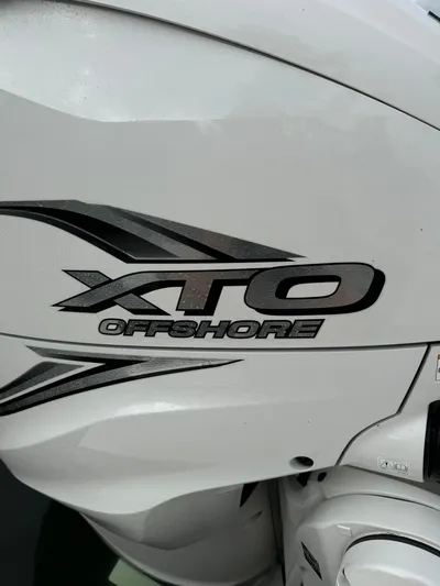 Harley Quinn Yacht Photos Pics 2023 Regal 36 XO boat engine with XTO Offshore branding.