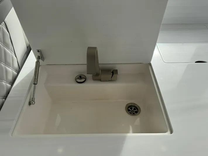 Harley Quinn Yacht Photos Pics 2023 Regal 36 XO yacht sink with modern faucet and clean design.