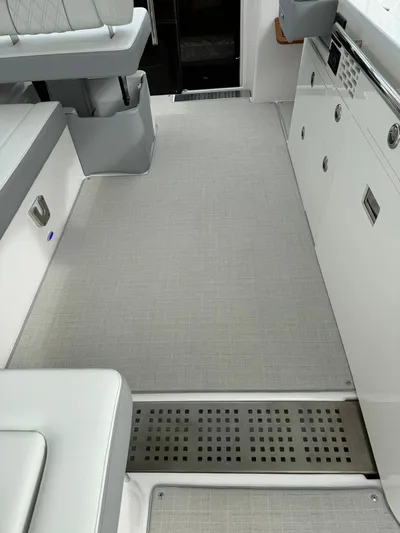 Harley Quinn Yacht Photos Pics 2023 Regal 36 XO boat interior with sleek seating and modern design elements.