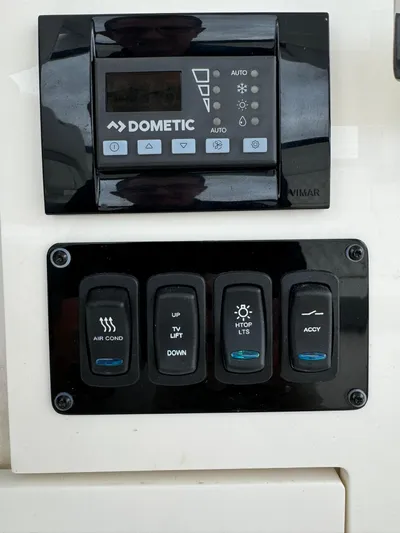 Harley Quinn Yacht Photos Pics Control panel of a 2023 Regal 36 XO boat with Dometic system.