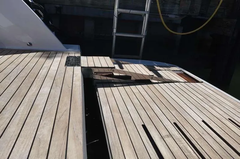  Yacht Photos Pics 2024 Sessa Marine C44 Cruiser deck with wooden finish and ladder.