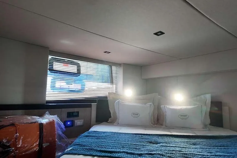  Yacht Photos Pics Luxurious cabin interior of 2024 Sessa Marine C44 Cruiser with cozy bedding.