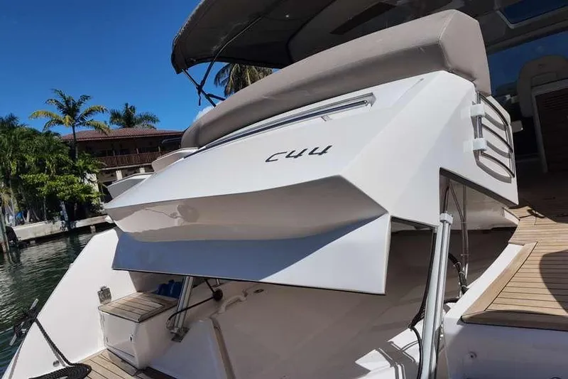  Yacht Photos Pics 2024 Sessa Marine C44 Cruiser, docked with palm trees in the background.